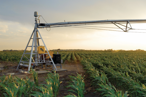 Center pivot irrigation system | Sunset field image | Agriculture watering system